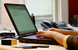 Customer using a laptop for Online Banking